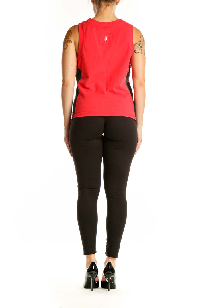 Red athletic tank top with black side panels, back view