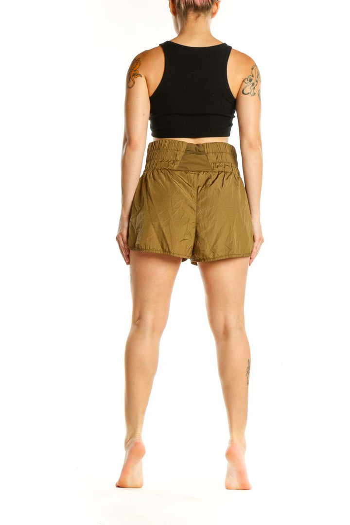 Olive bubble shorts with voluminous silhouette, back view on model wearing black crop top