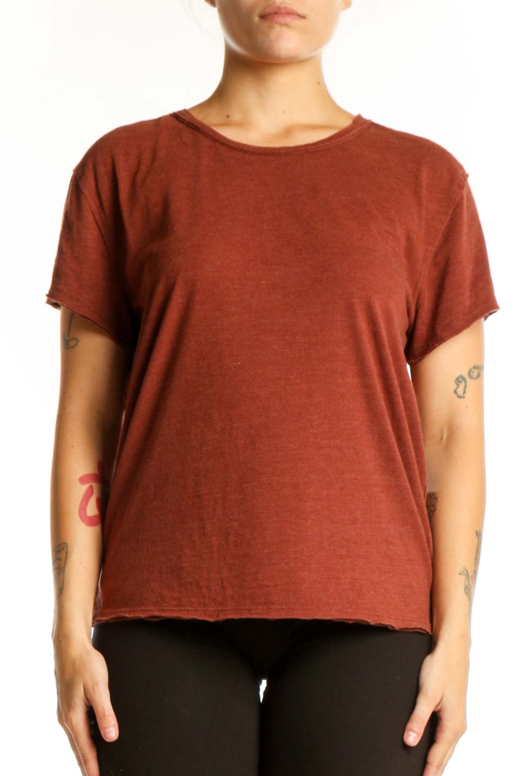 Rust organic cotton short sleeve crew neck tee by WE THE FREE, front view on model