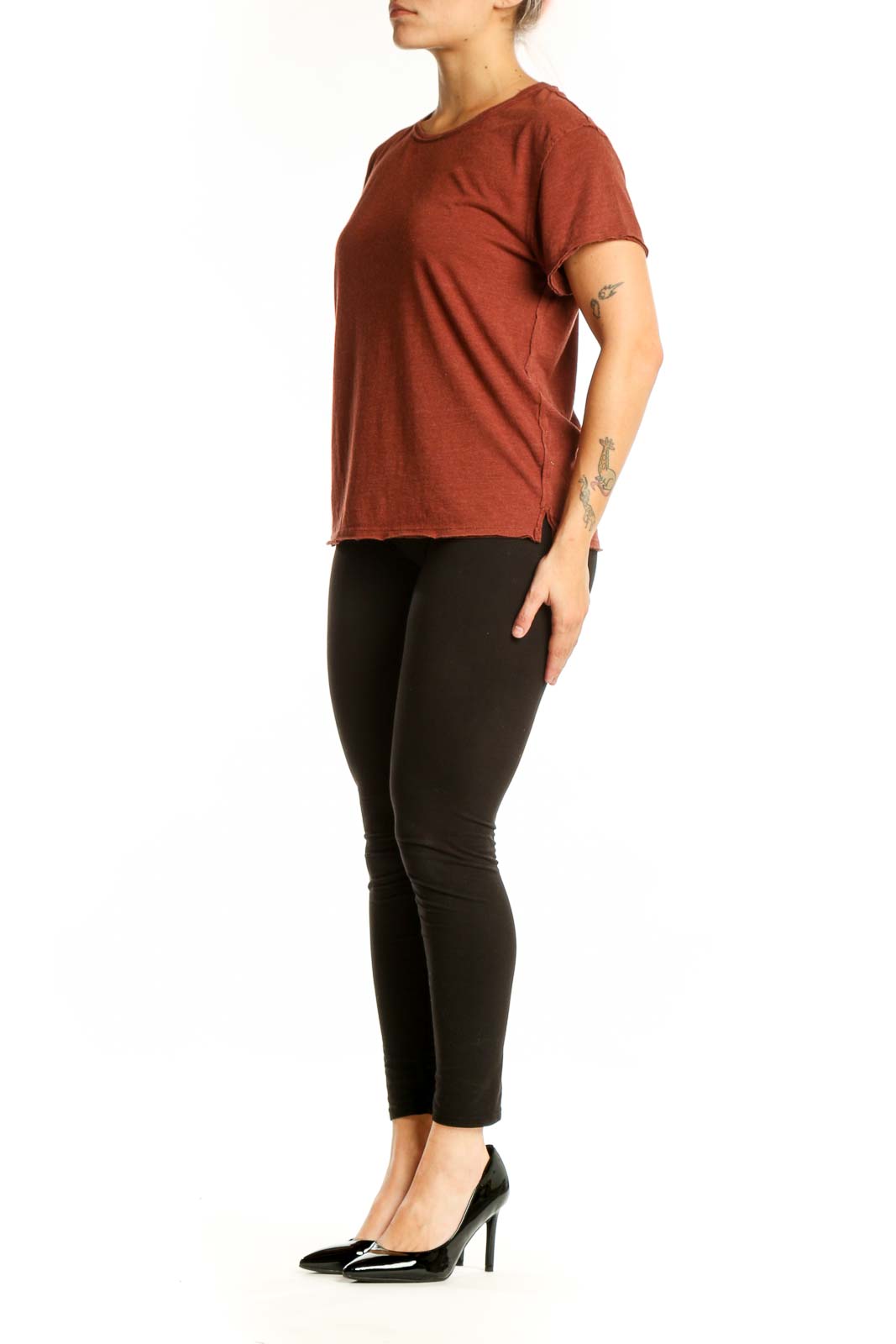 Rust organic cotton short sleeve crew neck tee by WE THE FREE, front view on model