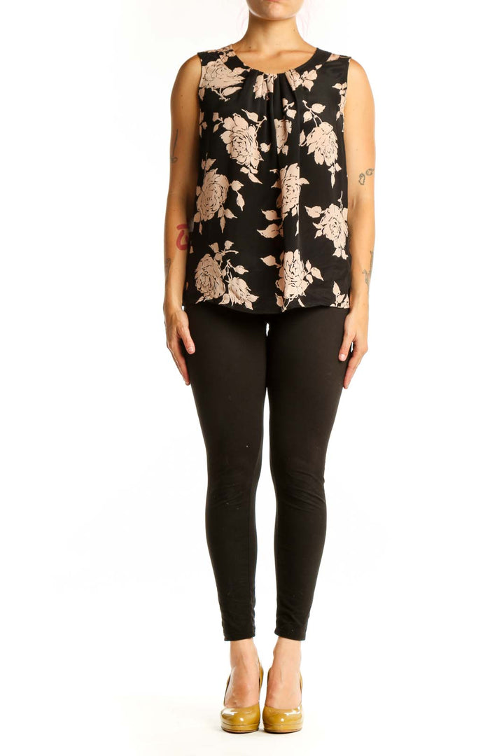 Black floral silk sleeveless top with cream and beige flower print and gathered neckline detail, front view