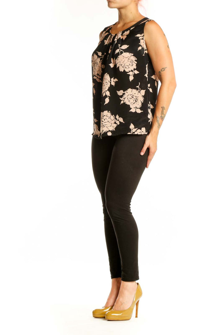 Black floral silk sleeveless top with cream and beige flower print and gathered neckline detail, front view
