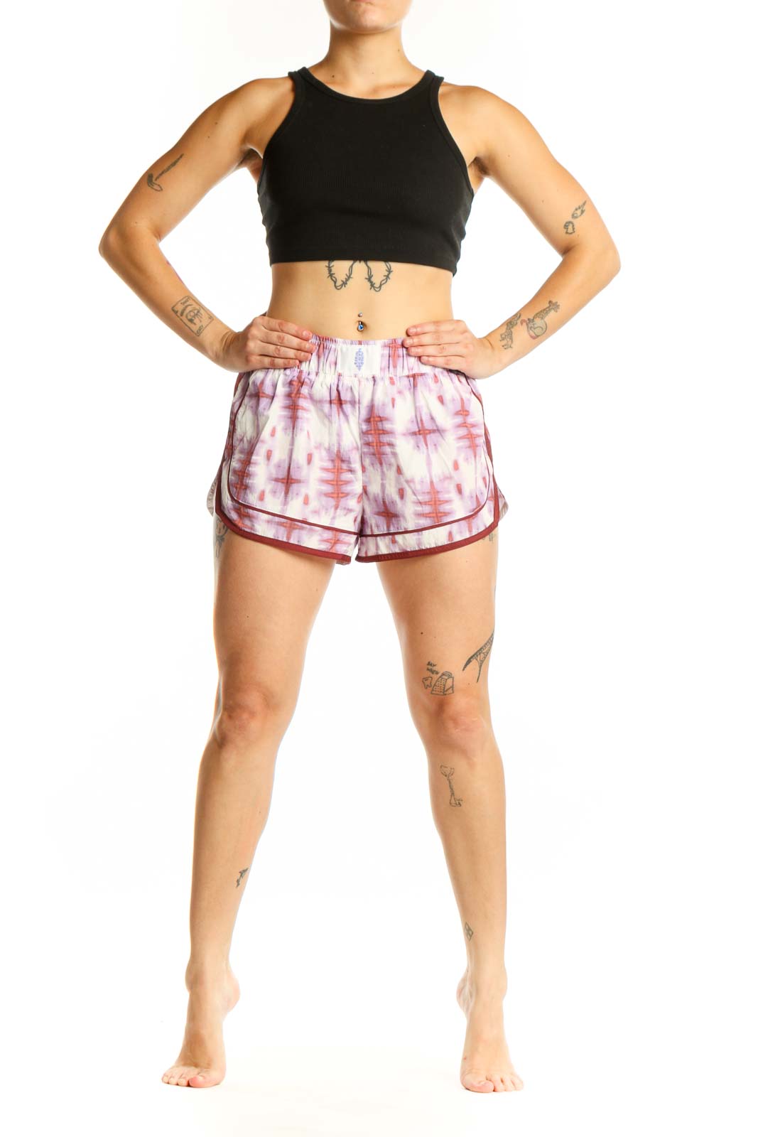 Front view of pink tie dye athletic shorts with burgundy trim by Free People Movement, size S