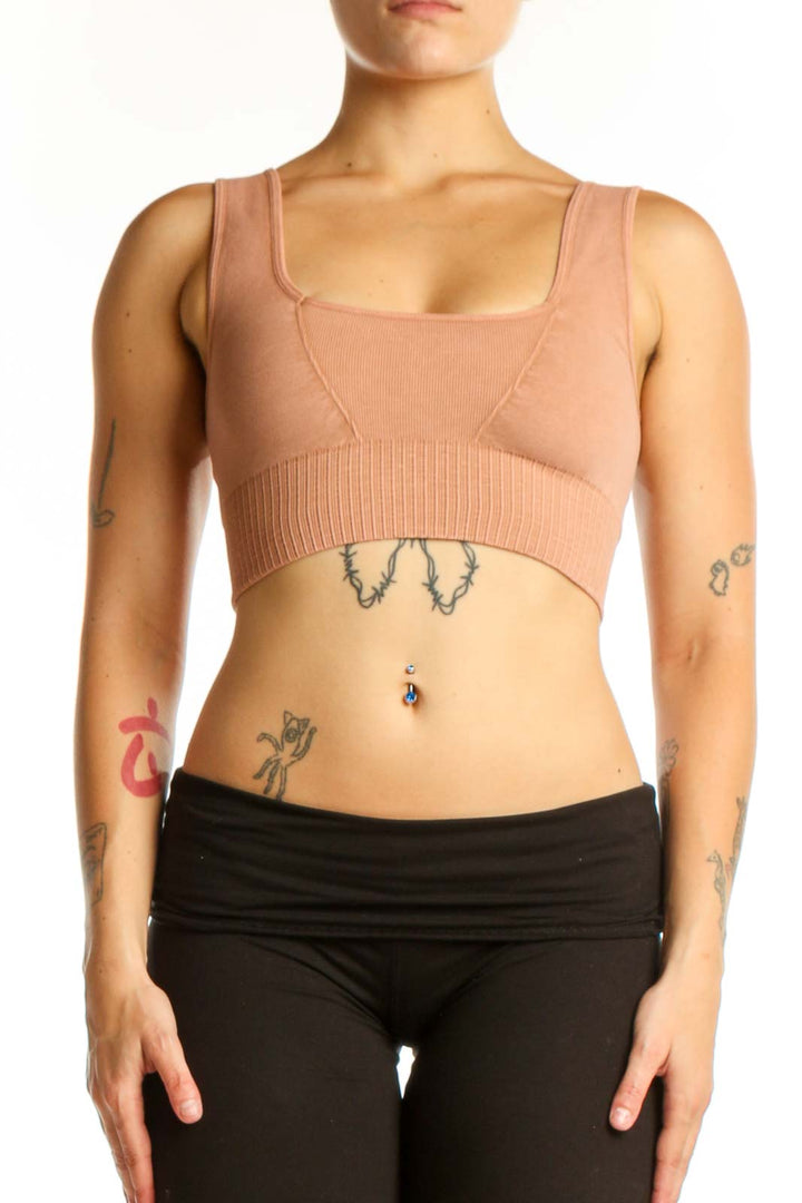 Beige ribbed crop top sports bra front view on model, square neckline design with supportive construction