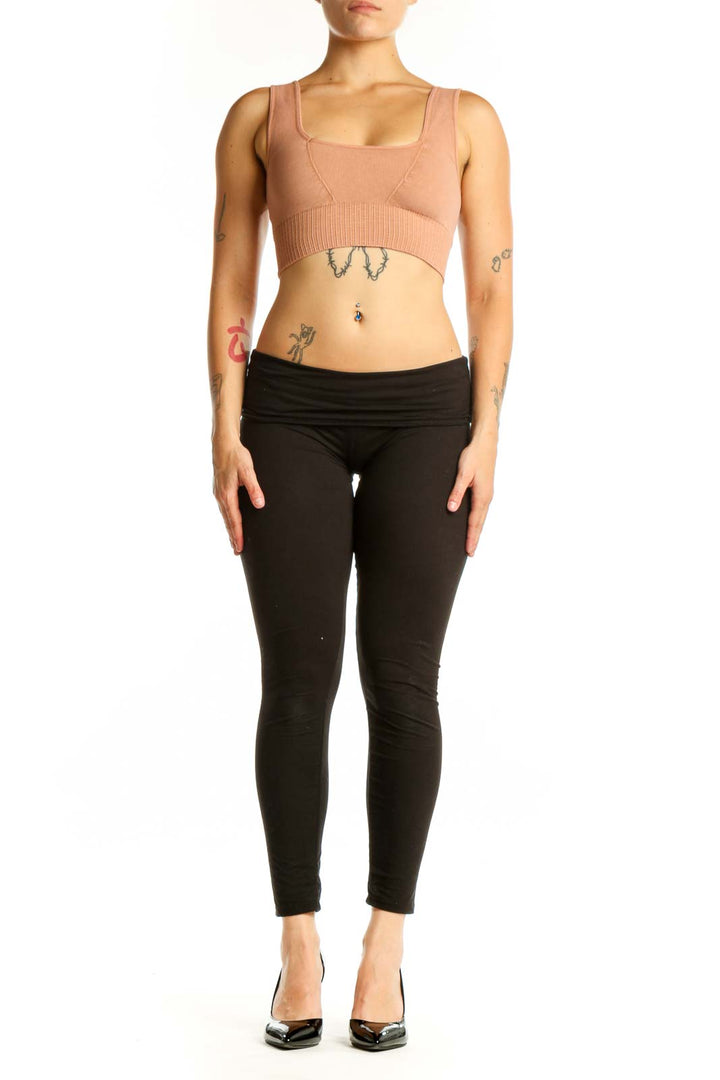 Beige ribbed crop top sports bra front view on model, square neckline design with supportive construction
