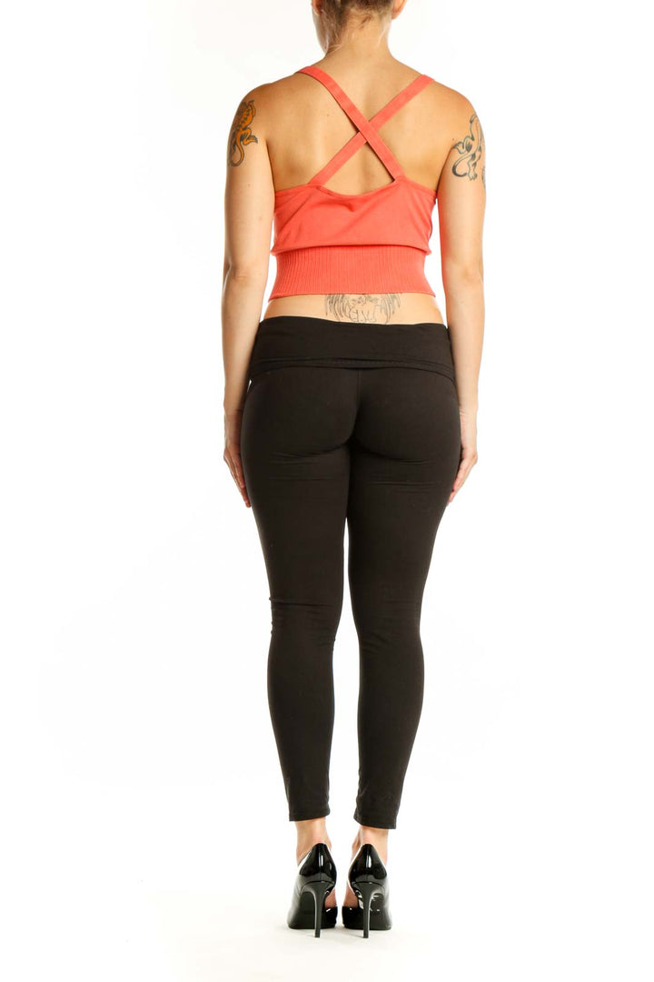 Coral ribbed crop tank top back view showing fitted silhouette and ribbed texture detail