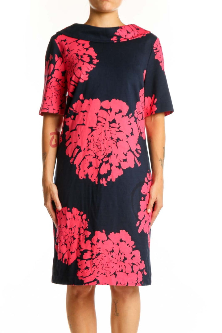 Black shift dress with vibrant pink floral print, short sleeves, crew neckline, front view