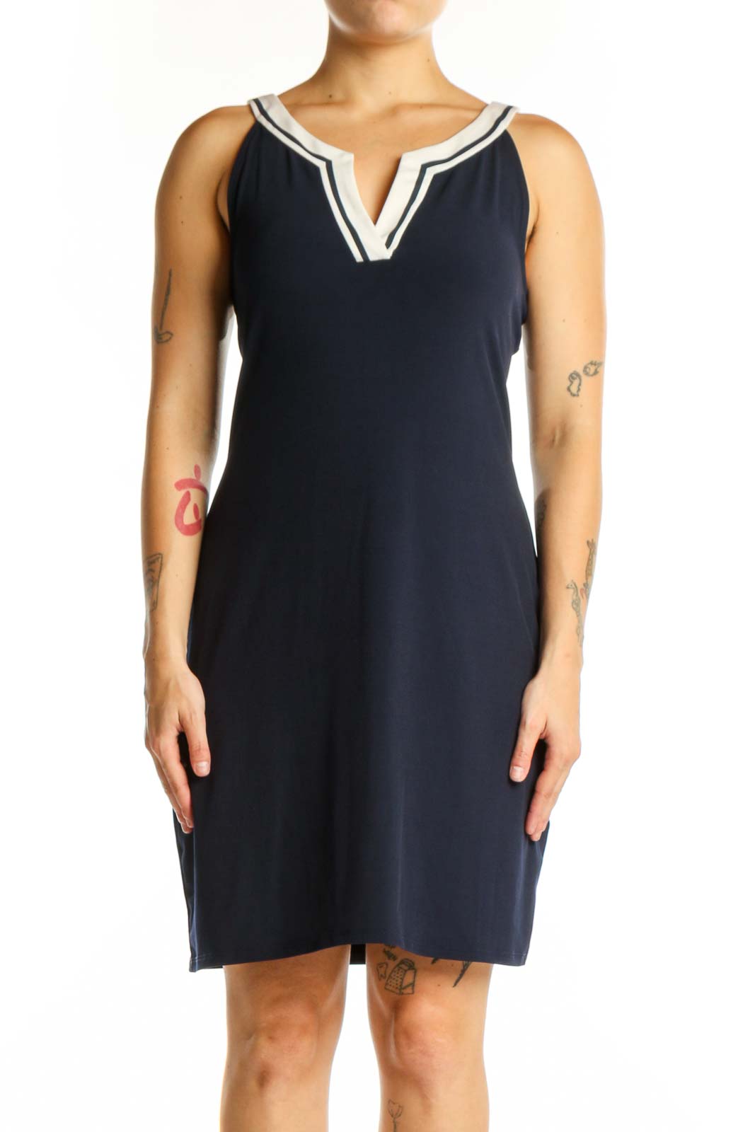 Navy sleeveless shift dress with white V-neck trim, front view