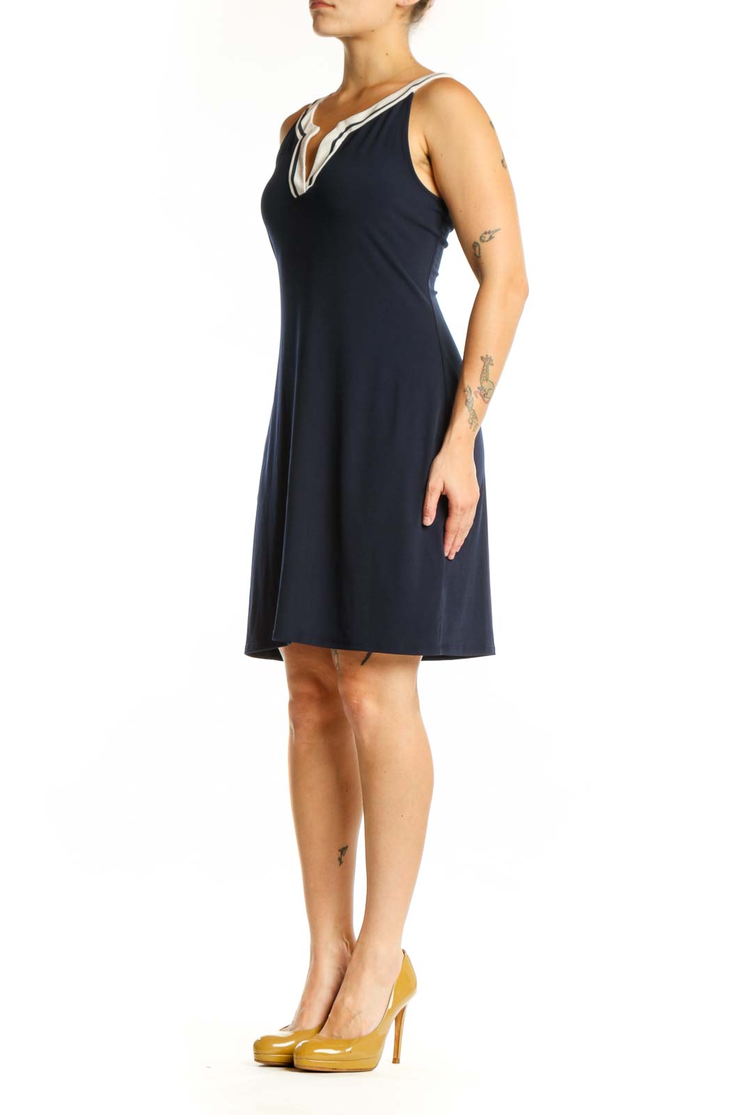 Navy sleeveless shift dress with white V-neck trim, front view
