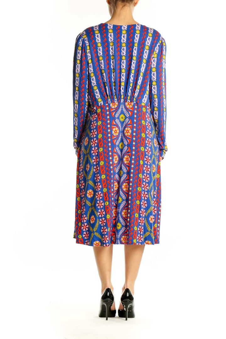 Back view of blue multicolor geometric print Boden midi dress showing A-line silhouette and tribal pattern details