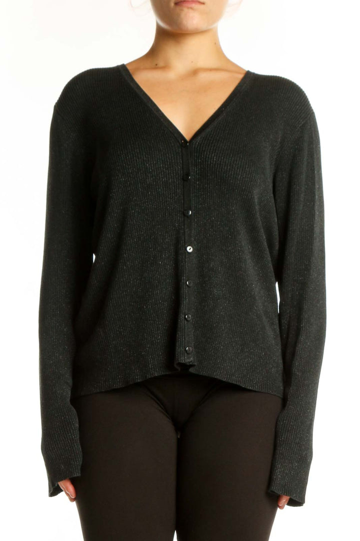 Charcoal silk lurex cardigan with V-neckline and button-front closure, worn with black pants