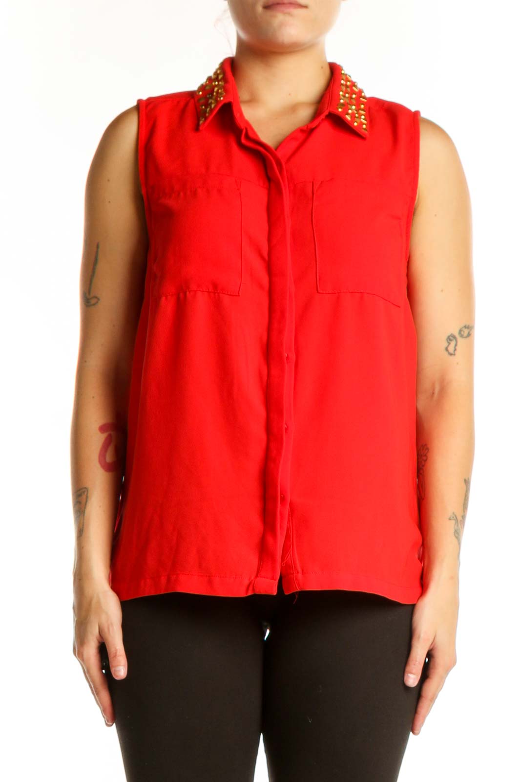 Red sleeveless button-up top with gold studded collar, front view on model