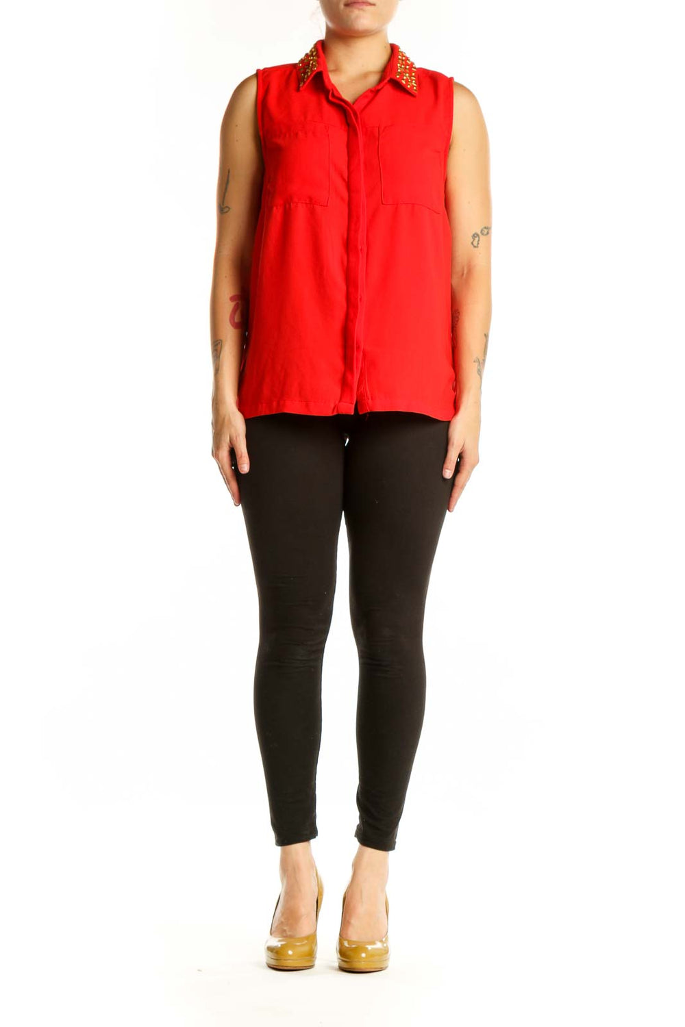 Red sleeveless button-up top with gold studded collar, front view on model