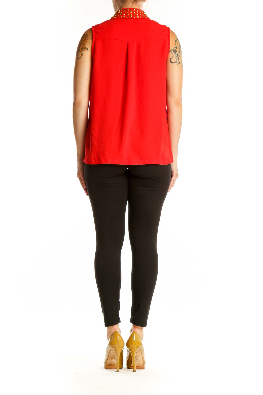 Red sleeveless button-up top with gold studded collar, back view on model