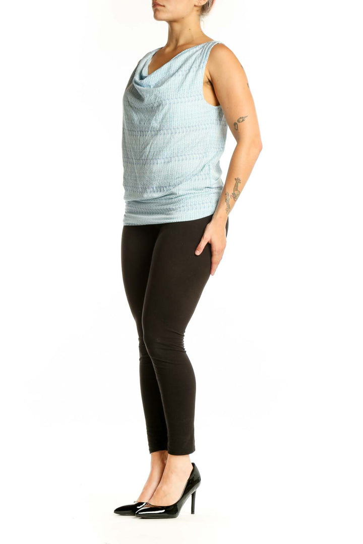 Blue cowl neck sleeveless tank top with ruched sides, front view on model