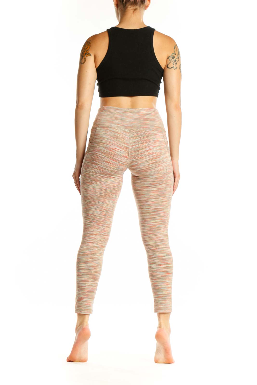 Back view of multicolor striped athletic leggings showing fitted silhouette and stripe pattern continuity from waist to ankle