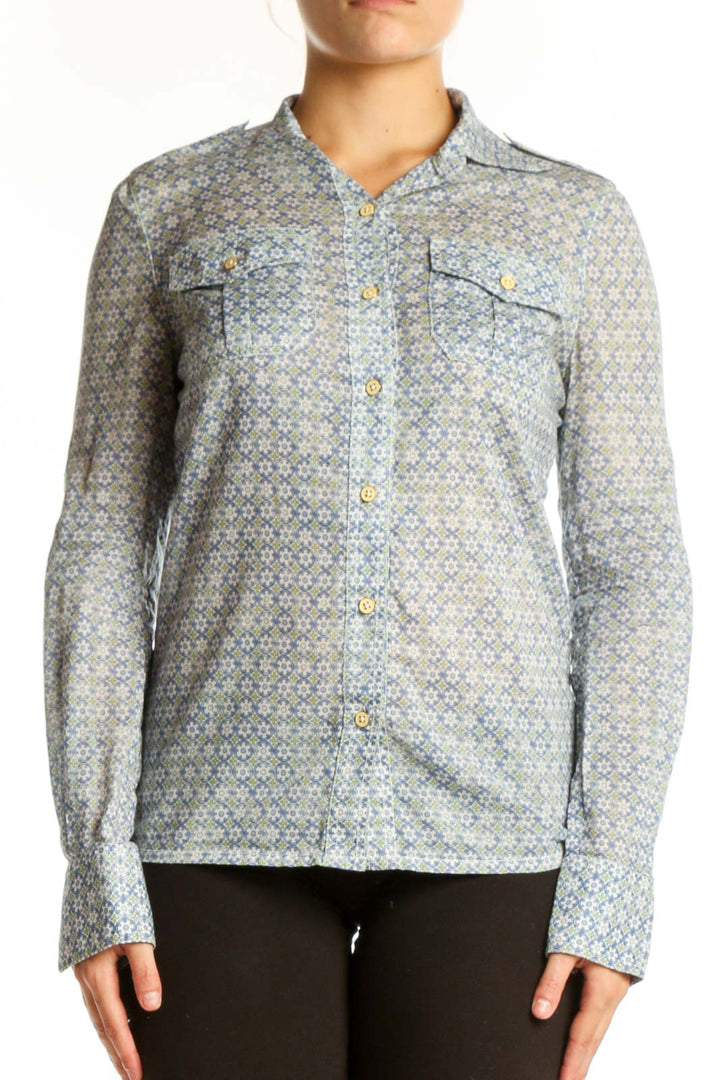 Tory Burch blue geometric cotton button-up shirt with collared neckline and chest pockets, front view on model