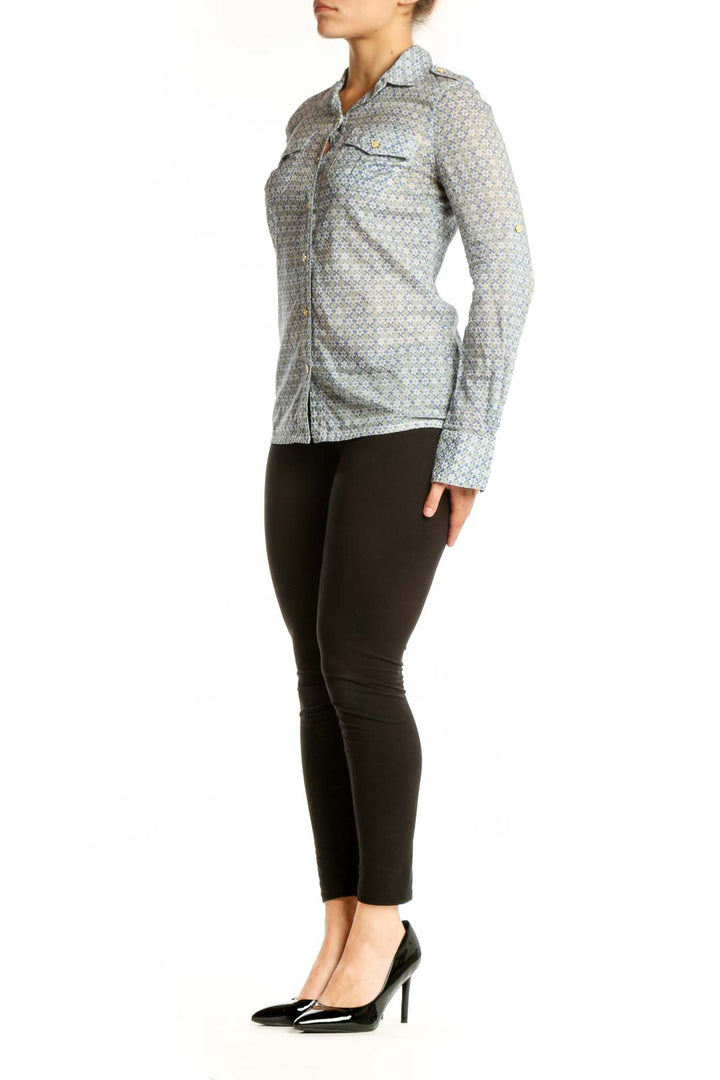 Tory Burch blue geometric cotton button-up shirt with collared neckline and chest pockets, front view on model