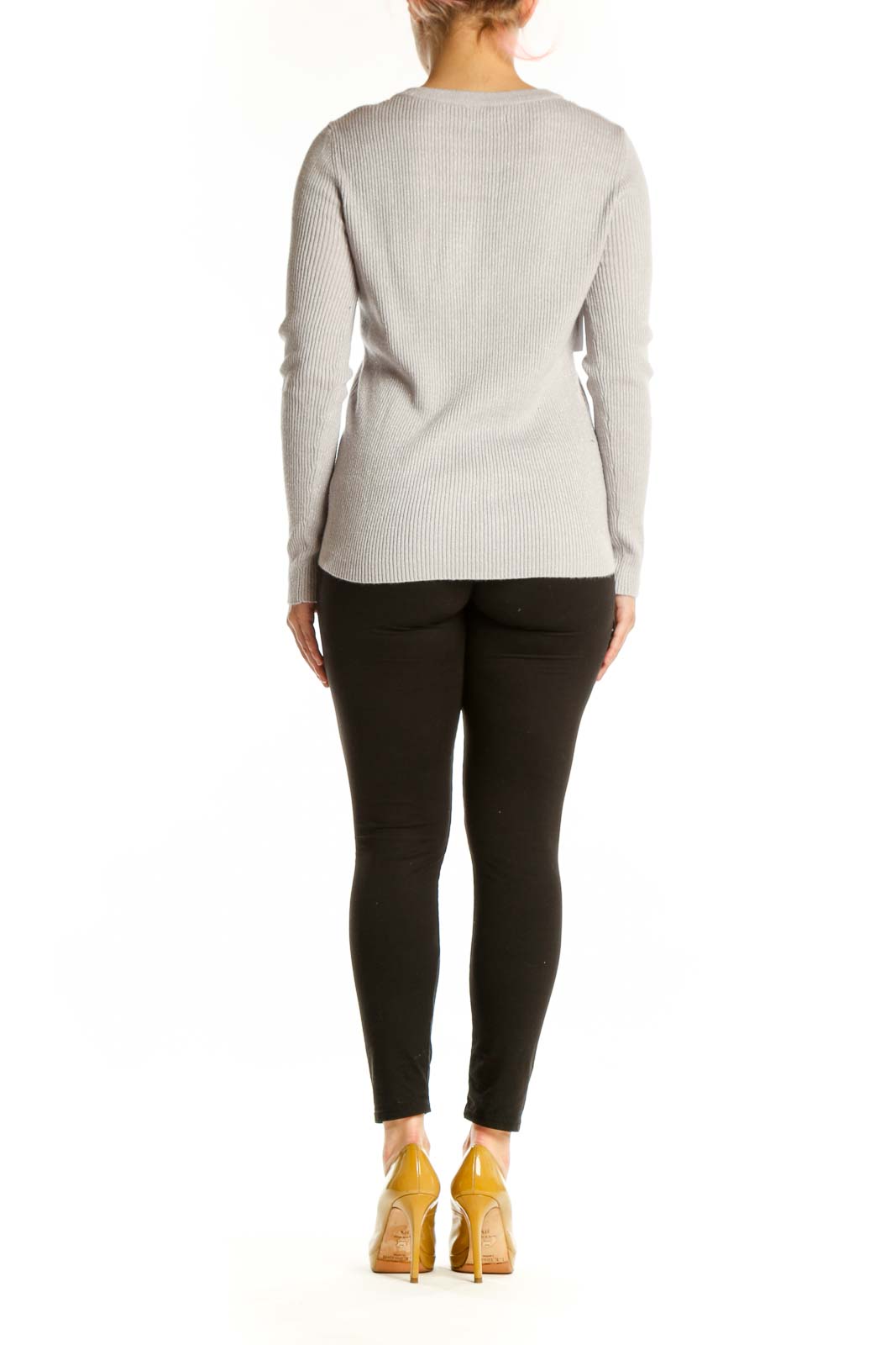Back view of cream ribbed knit sweater showing vertical ribbed pattern and fitted silhouette