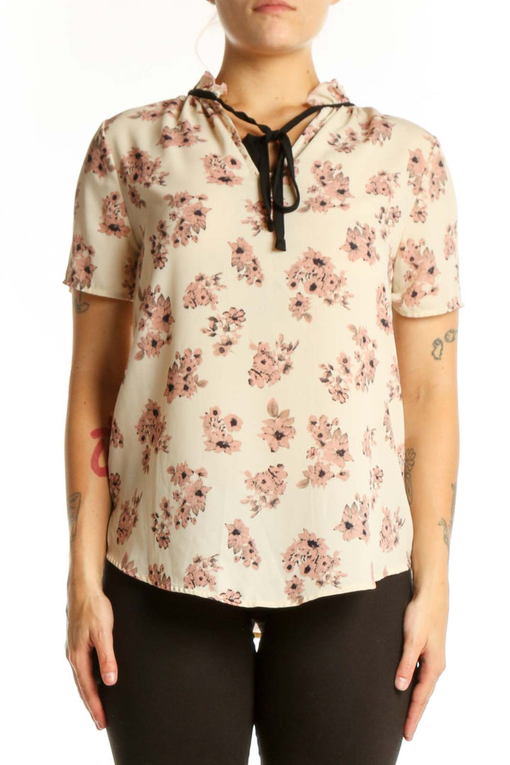 SilkRoll cream floral blouse with pink flowers and black lace-up neckline detail, front view