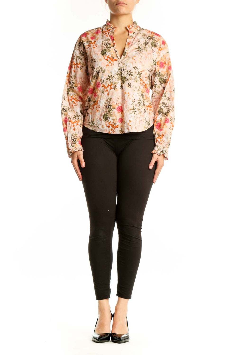 Cream floral Pima cotton button-up top by Amo with coral, pink, and sage green flowers, front view on model
