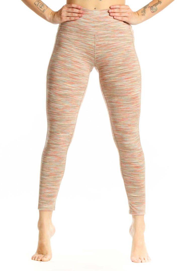 Front view of multicolor striped high-waist yoga leggings by DSG in size small, showing vibrant horizontal stripes and high-waist design