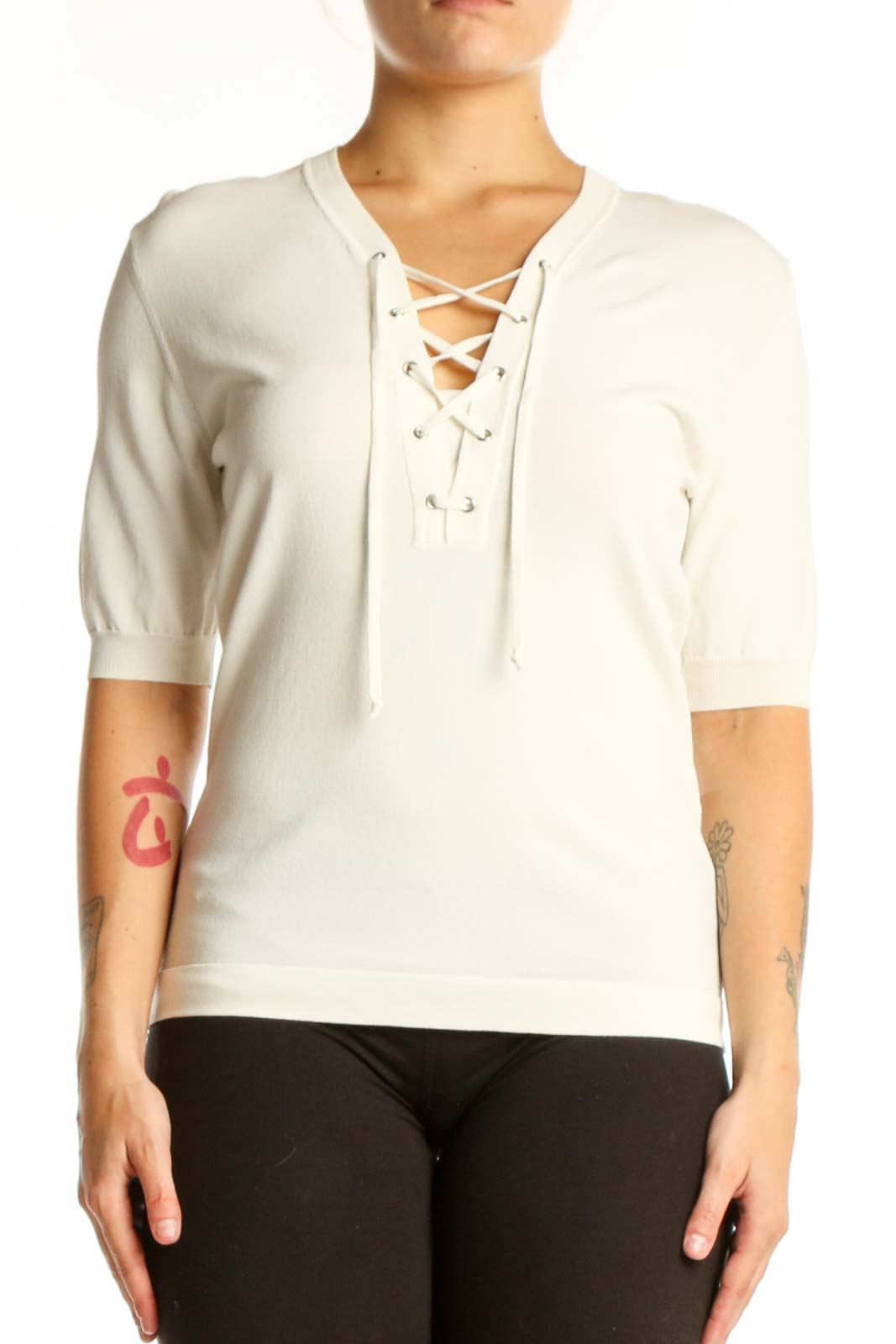 Cream lace-up V-neck top with three-quarter sleeves, front view on model