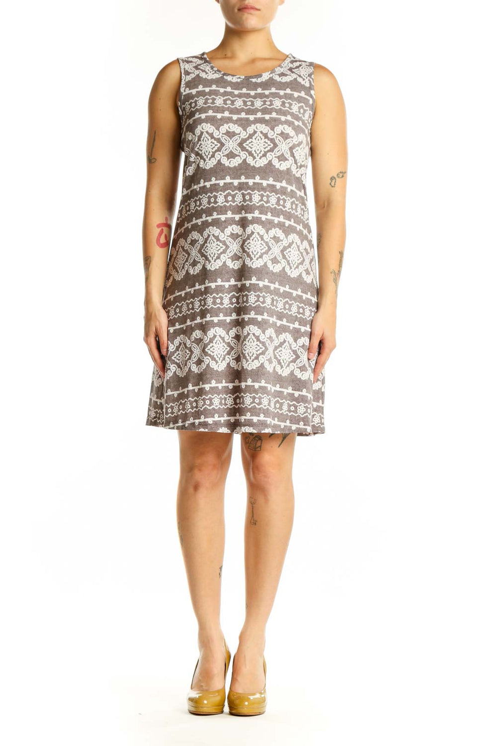 Front view of taupe geometric print A-line dress with cream and white diamond motifs, sleeveless crew neckline design