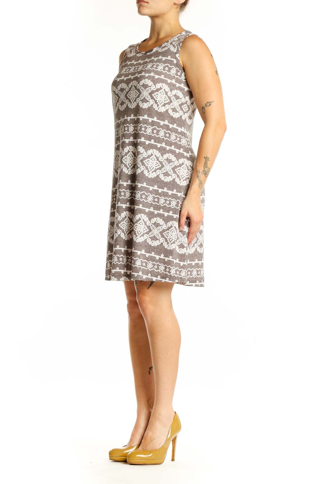 Front view of taupe geometric print A-line dress with cream and white diamond motifs, sleeveless crew neckline design