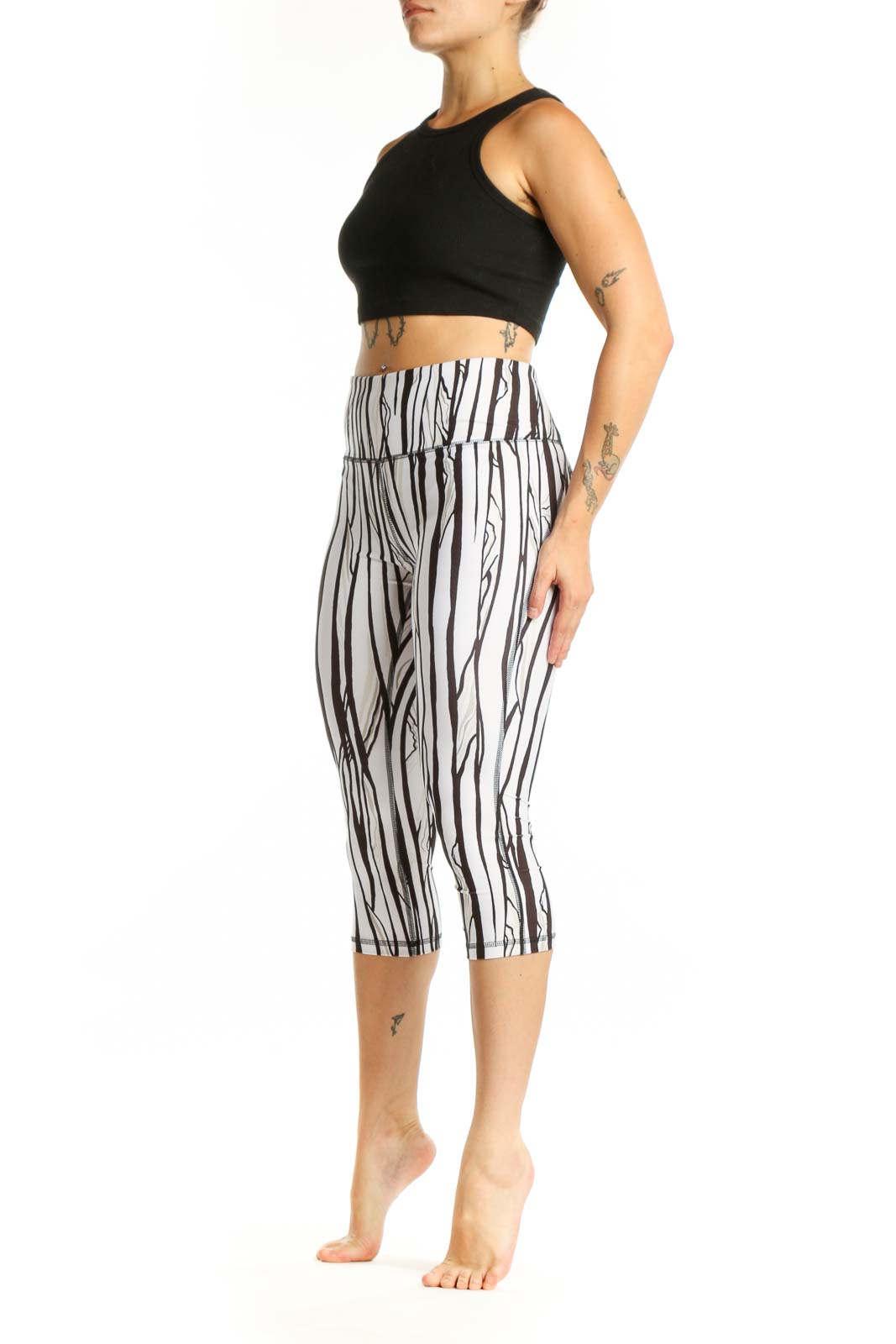White and black striped DSG capri leggings with high-waisted design, front view
