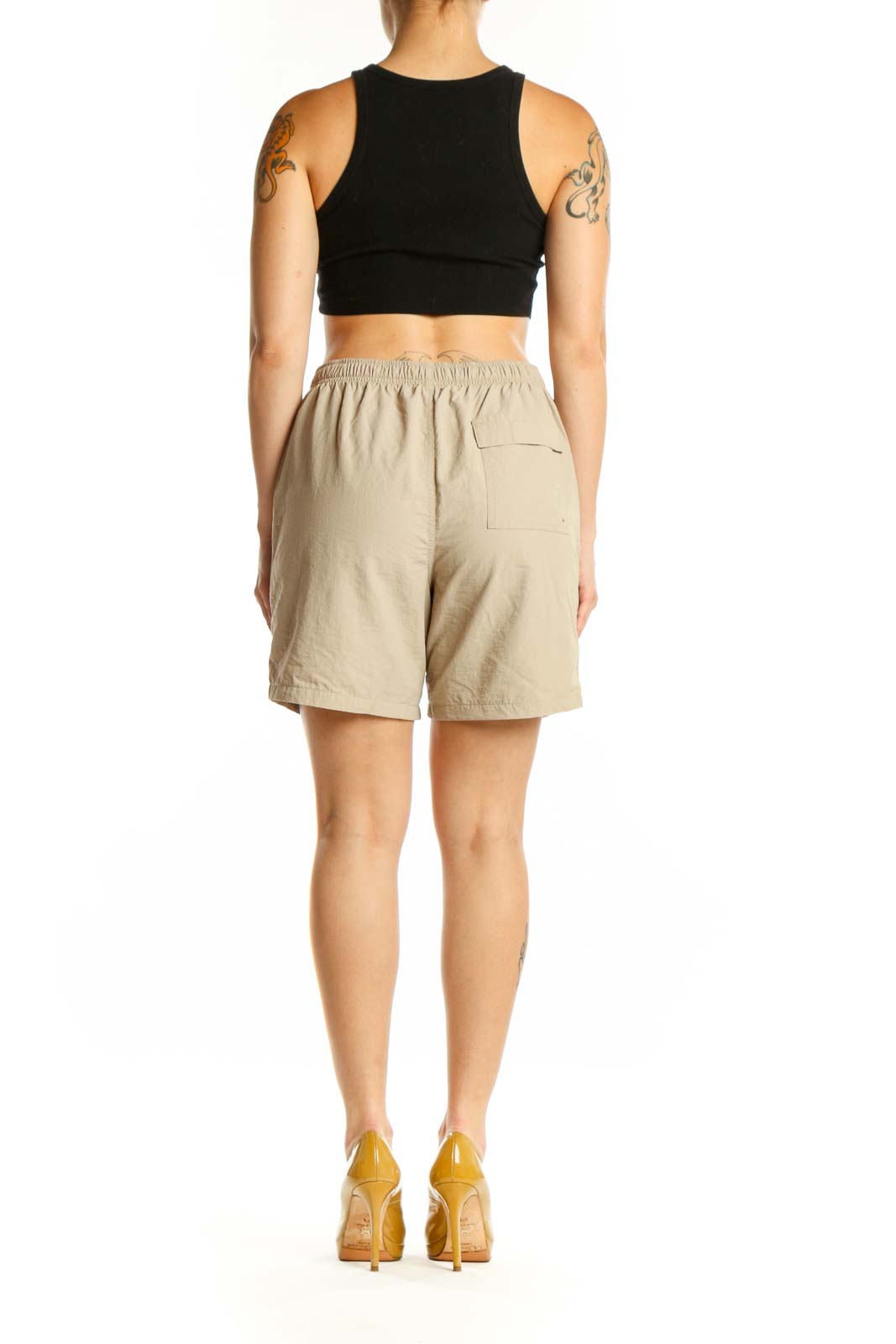 Beige DSG athletic shorts back view, showing relaxed fit and functional pockets