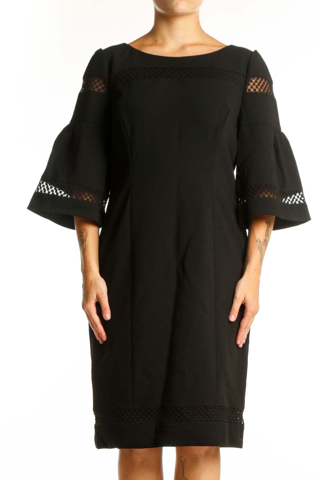 Black bell sleeve lace dress with mesh cutouts, front view on model