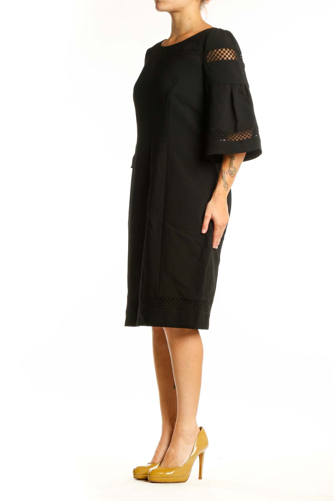 Black bell sleeve lace dress with mesh cutouts, front view on model