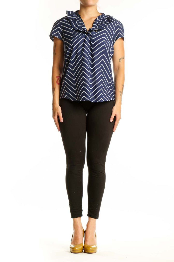 Navy and white chevron striped short sleeve top with V-neckline and tie detail, front view