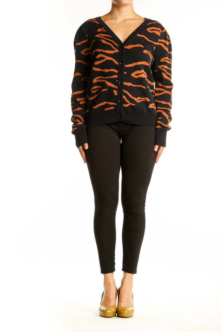 Black and orange tiger stripe cardigan by Amour Vert with button-front closure and V-neckline, front view