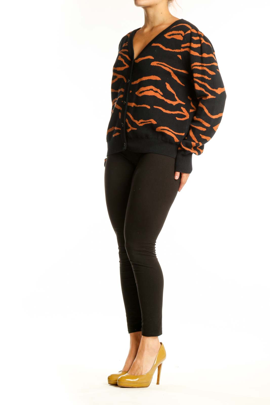Black and orange tiger stripe cardigan by Amour Vert with button-front closure and V-neckline, front view