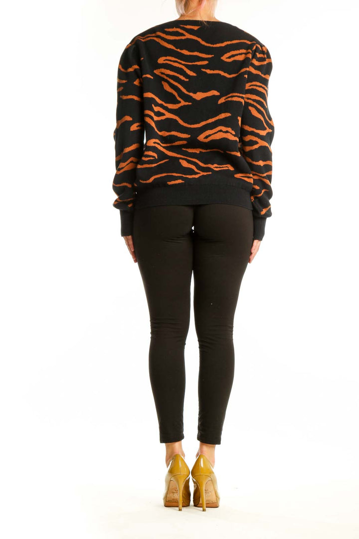Black and orange tiger stripe cardigan by Amour Vert, back view showing full length and pattern