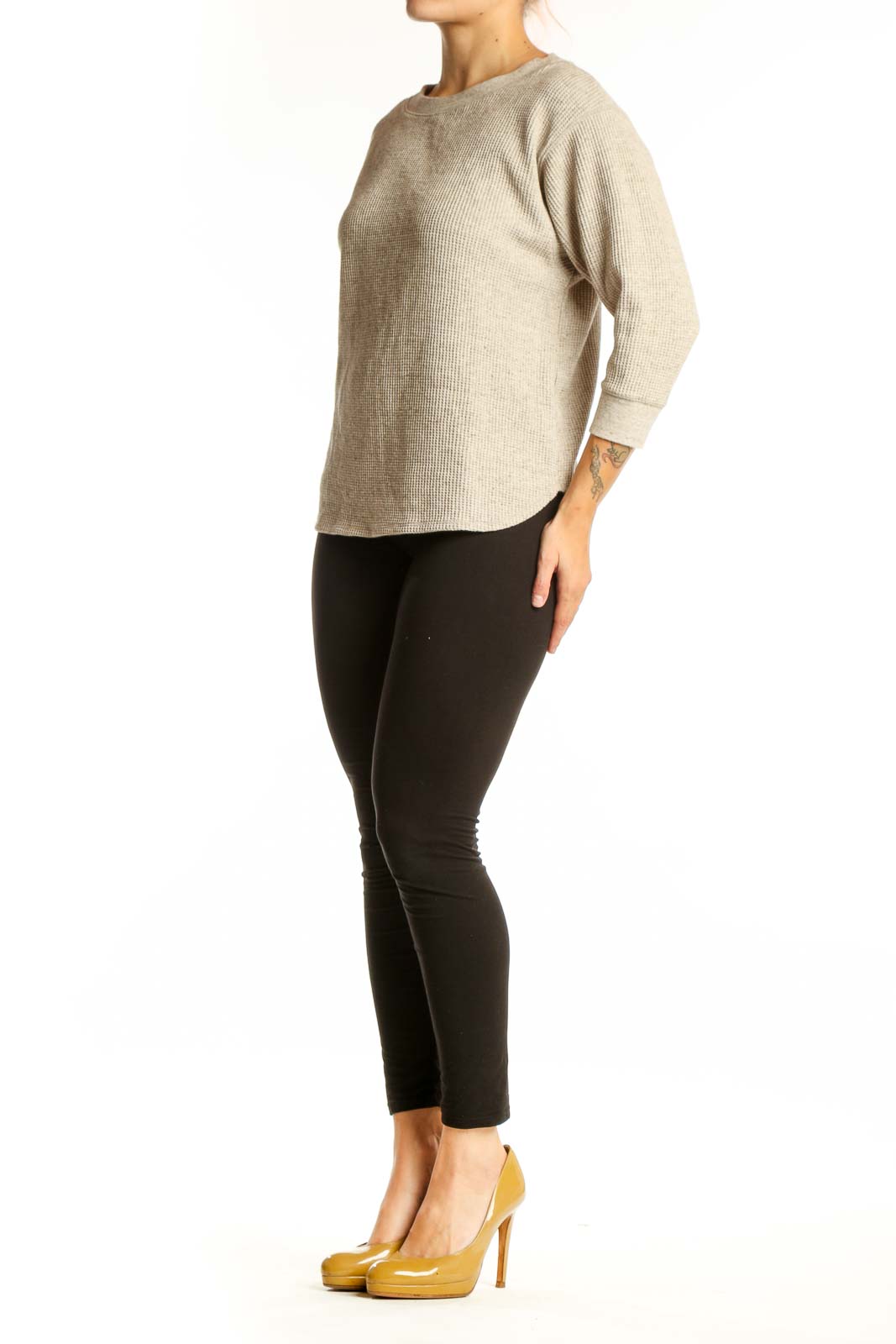 Beige ribbed cotton knit sweater with crew neckline and three-quarter sleeves, front view