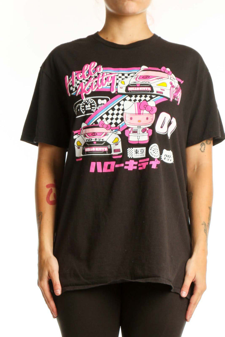 Black Hello Kitty racing graphic t-shirt front view with vibrant pink neon design, racing car illustration, and Japanese characters