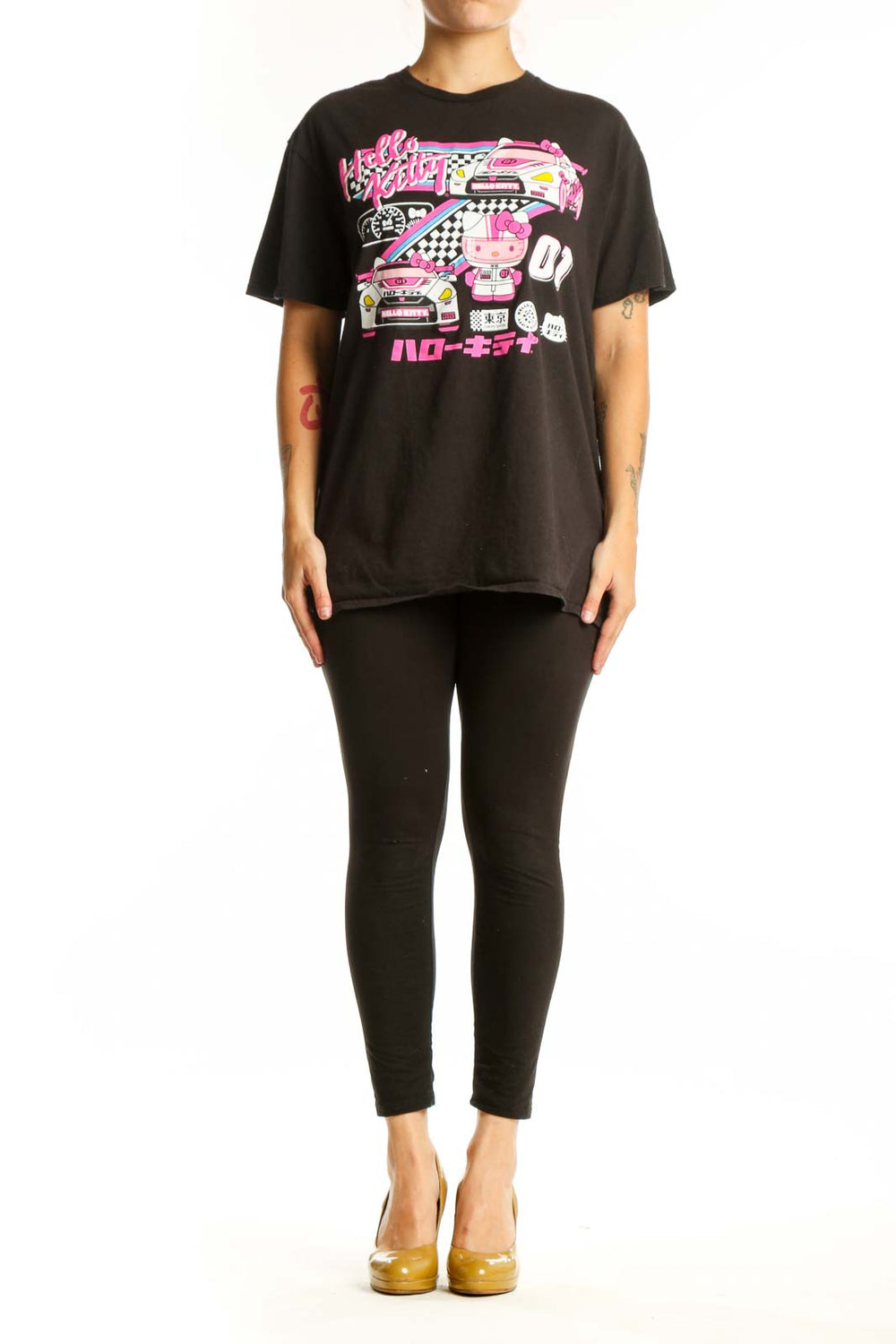 Black Hello Kitty racing graphic t-shirt front view with vibrant pink neon design, racing car illustration, and Japanese characters