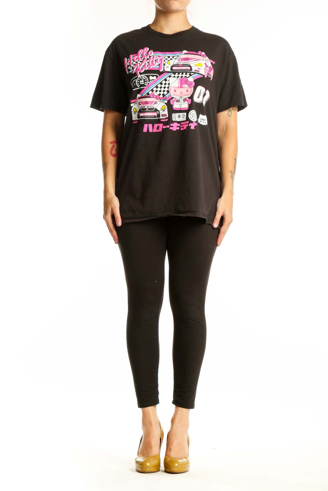 Black Hello Kitty racing graphic t-shirt front view with vibrant pink neon design, racing car illustration, and Japanese characters