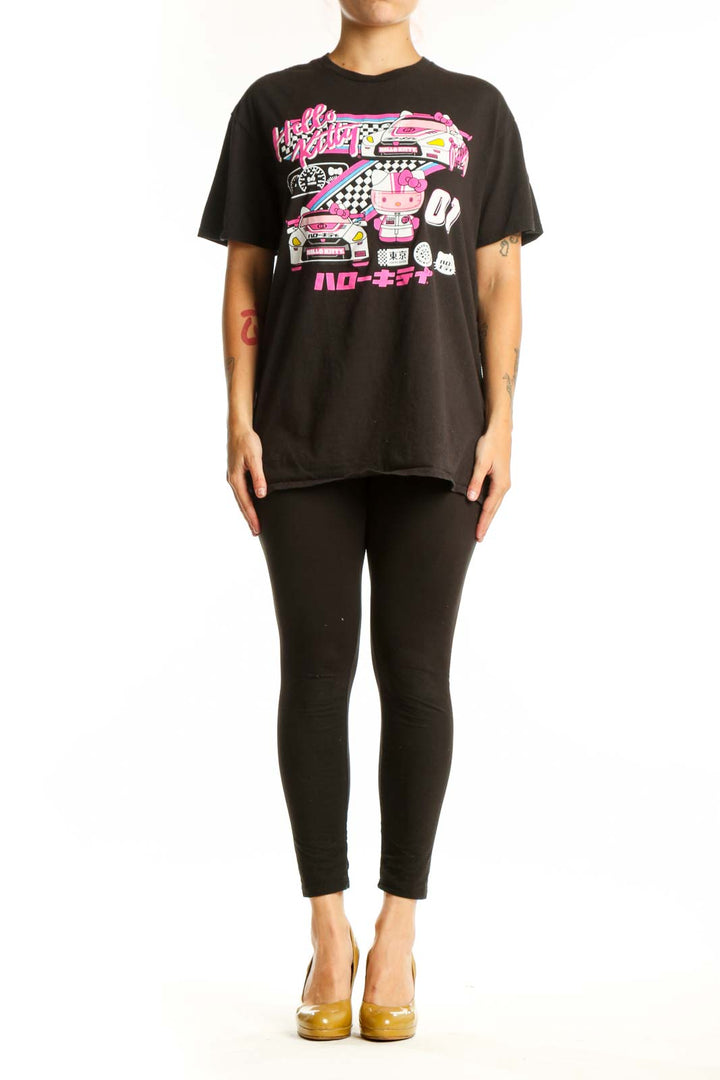 Black Hello Kitty racing graphic t-shirt front view with vibrant pink neon design, racing car illustration, and Japanese characters