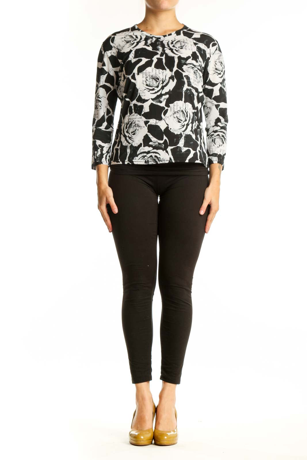 Black and white floral rose print top with three-quarter sleeves, front view on model