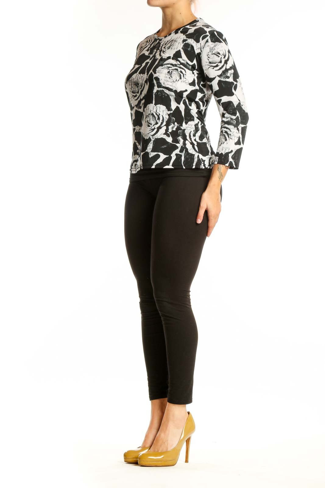 Black and white floral rose print top with three-quarter sleeves, front view on model