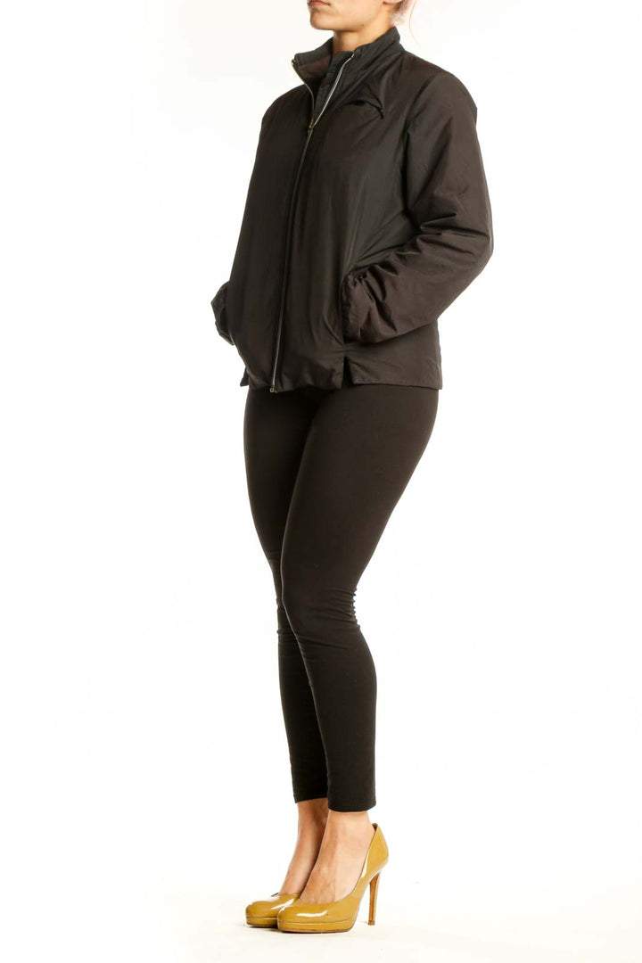 Black puffer jacket with full-length zip closure and stand collar, front view