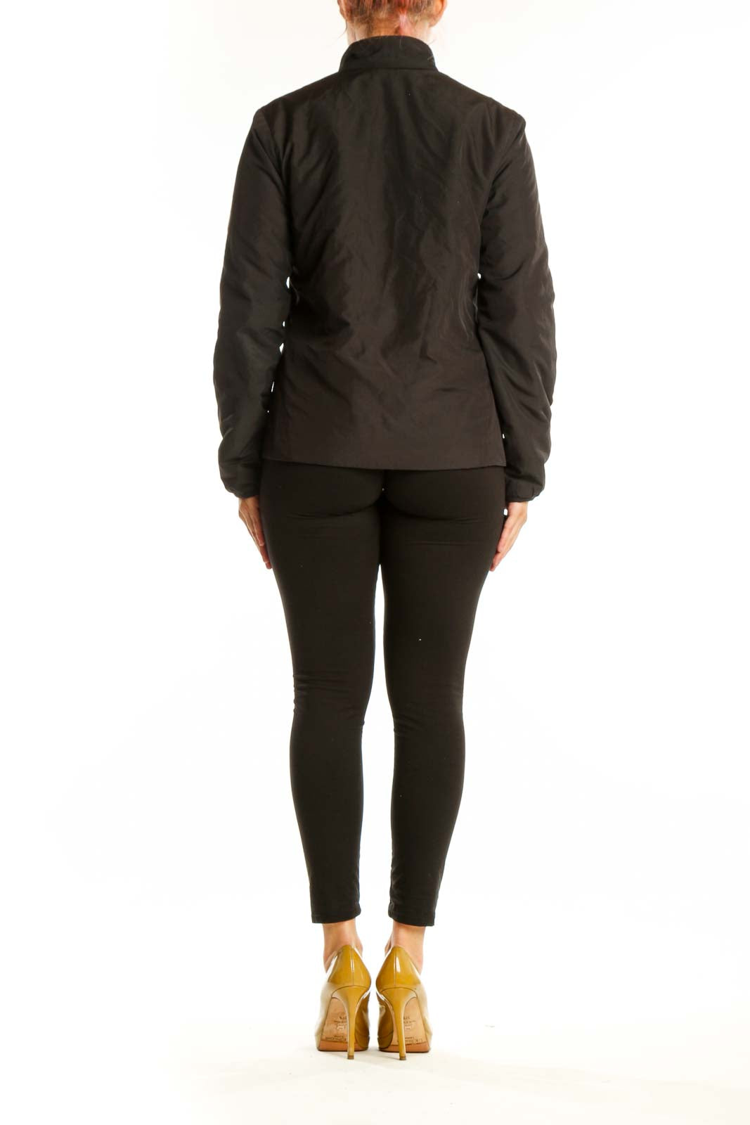 Black quilted puffer jacket back view showing structured silhouette and design