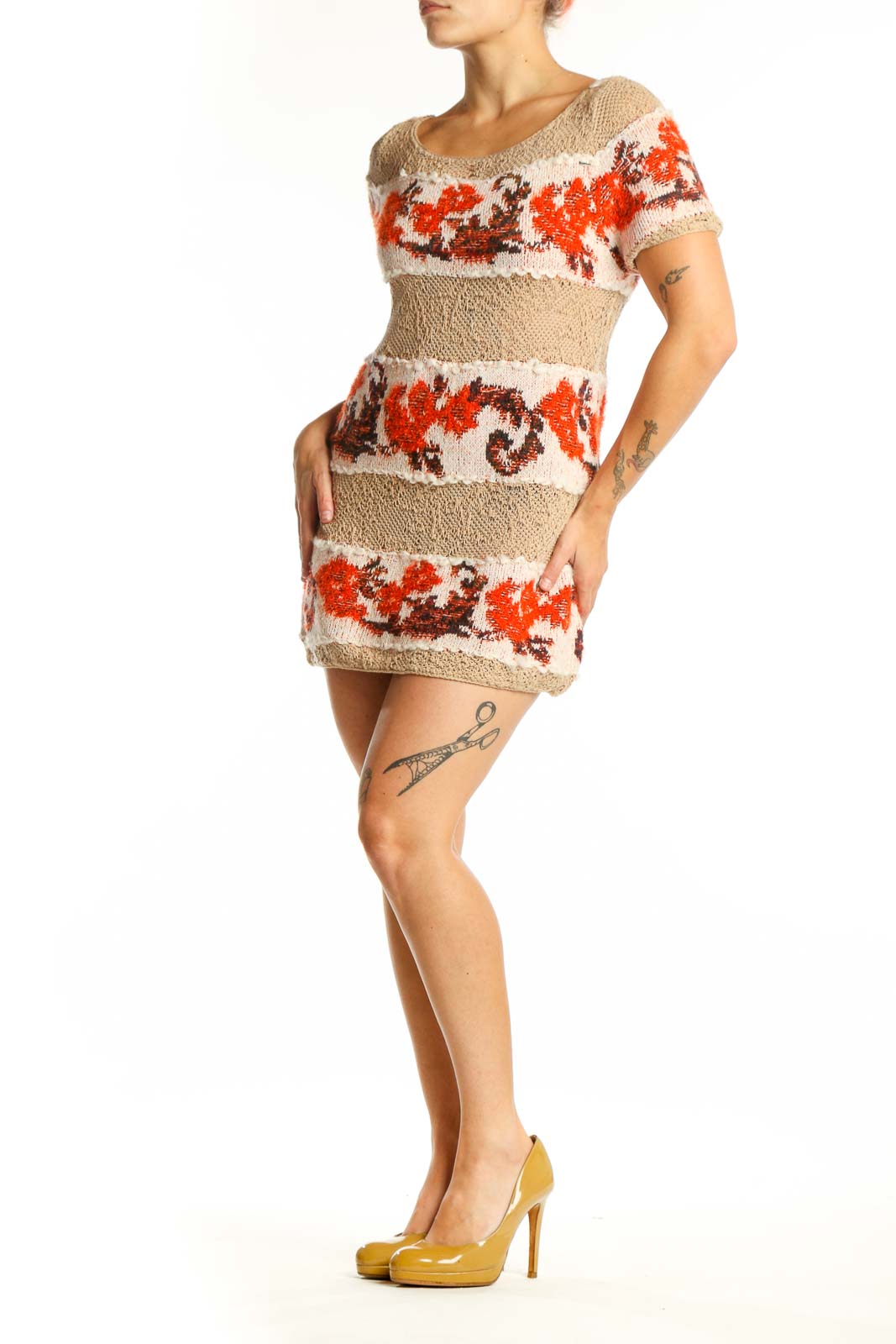 Beige knit sweater dress with red and burgundy floral jacquard horizontal stripes, short sleeves, and fitted silhouette - front view