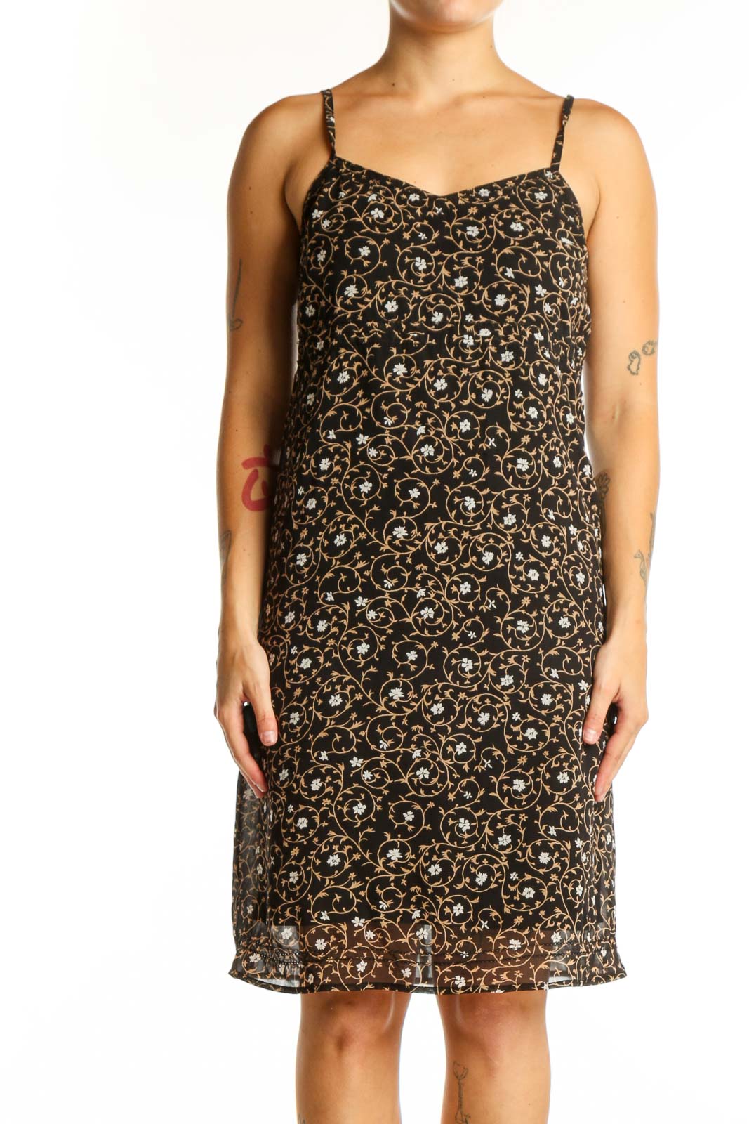 Black floral camisole slip dress with cream and gold print, front view on model