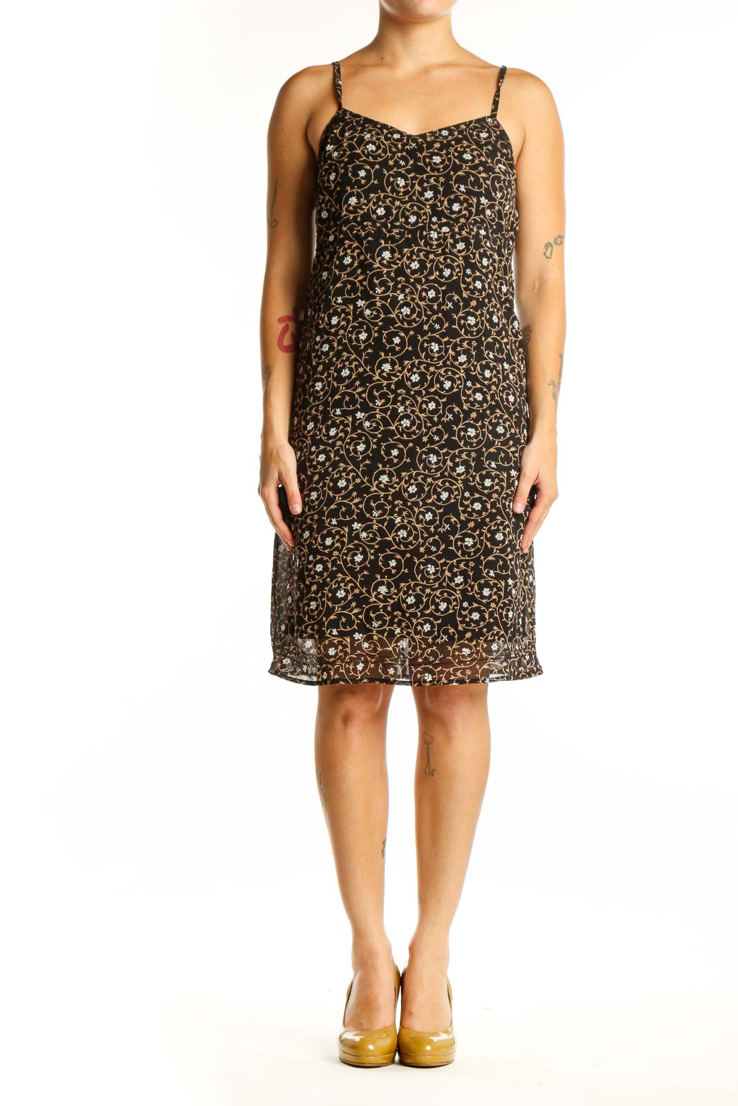 Black floral camisole slip dress with cream and gold print, front view on model
