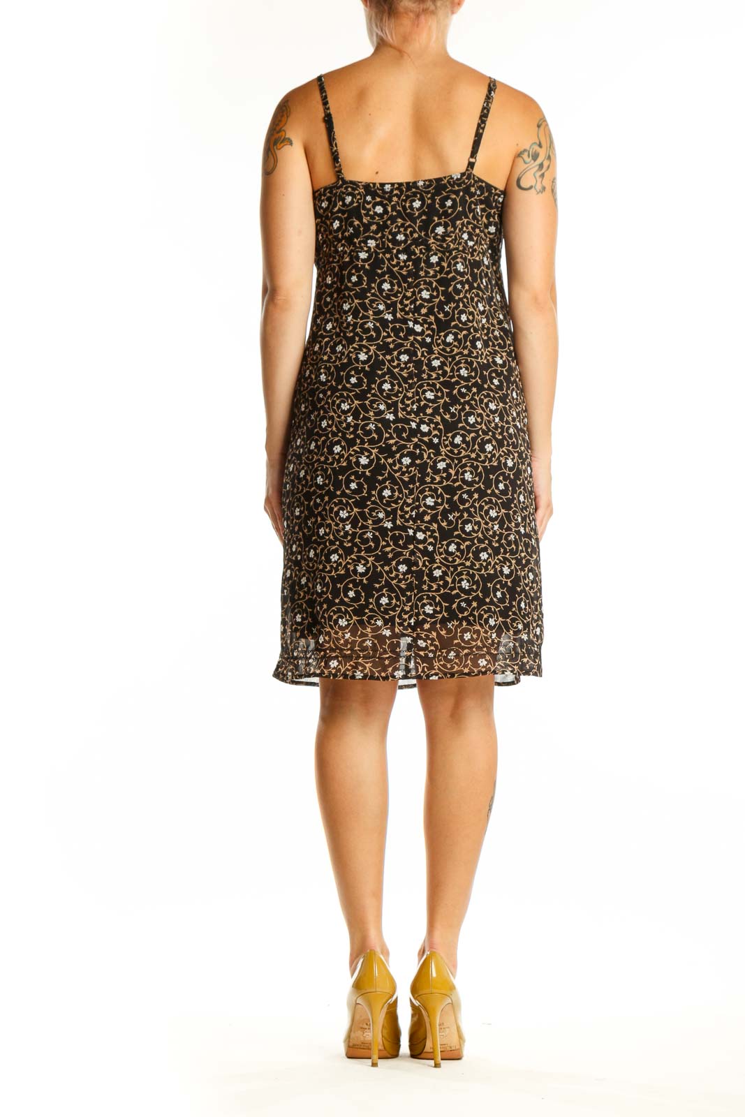 Black floral camisole slip dress with cream and gold print, back view on model